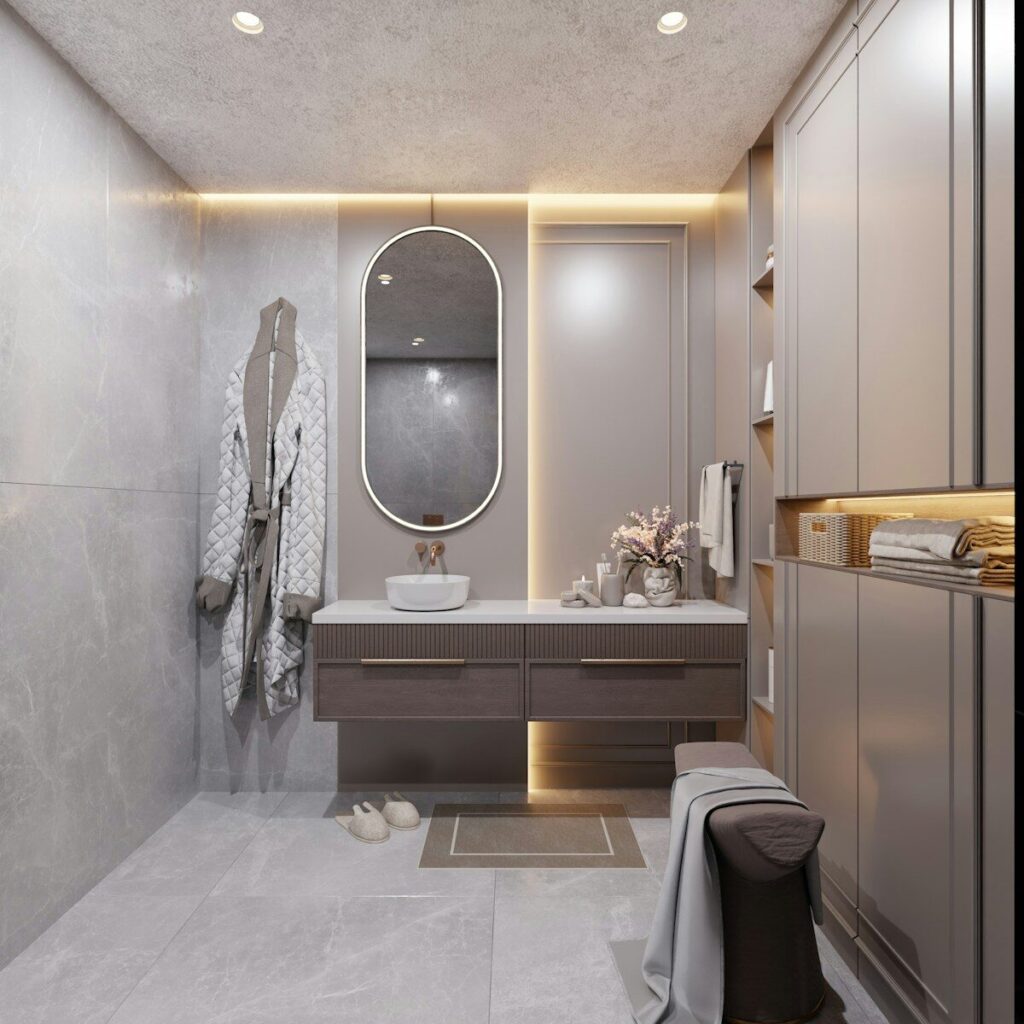 Modern bathroom with vanity, mirror, and robe.